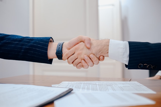 Business people making a deal with a handshake
